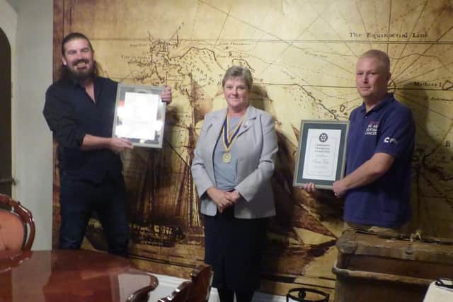 President of the Rotary Club of Louth, Pam Ashley-Marsh, presenting the two most recent awards to Paul Hugill (left) and Simon West (right).
