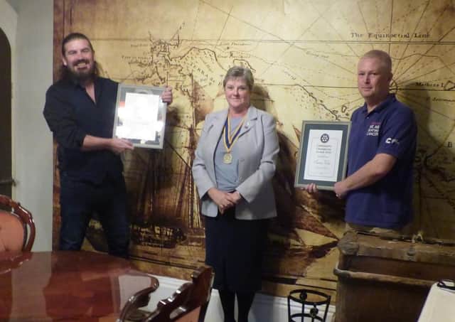 President of the Rotary Club of Louth, Pam Ashley-Marsh, presenting the two most recent awards to Paul Hugill (left) and Simon West (right).