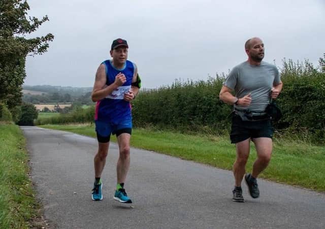 Simon Greenfield training for his marathon challenge, alongside Kev Houghton.