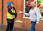 Debbie Bollard (right) handing a shopping list to one of the community support group volunteers outside the Co-op in Woodhall Spa. EMN-200710-112321001