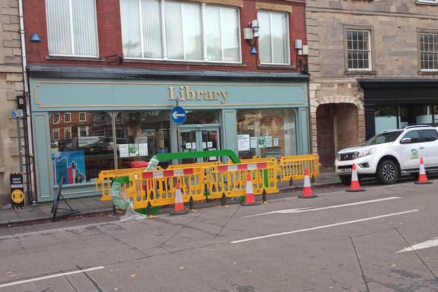 Operatives installing new 'pop-up' bike racks in Sleaford Market Place. EMN-200710-203548001