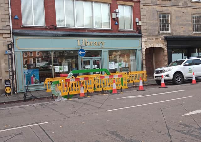 Operatives installing new 'pop-up' bike racks in Sleaford Market Place. EMN-200710-203548001