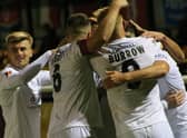 United celebrate at Leamington. Photo: Oliver Atkin.