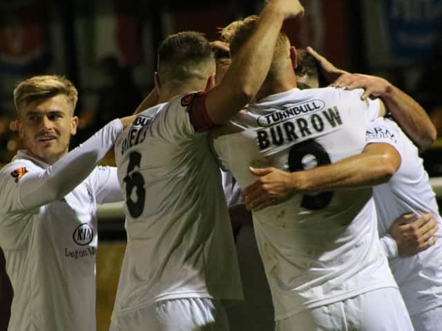 United celebrate at Leamington. Photo: Oliver Atkin.