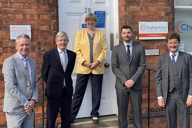 Marking the merger, the business' Richard Ludlow, Paul Howden, Katherine Bunting, Daniel Howden and Edward Conway.