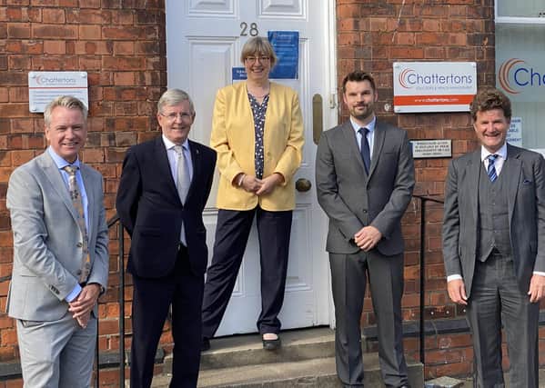 Marking the merger, the business' Richard Ludlow, Paul Howden, Katherine Bunting, Daniel Howden and Edward Conway.