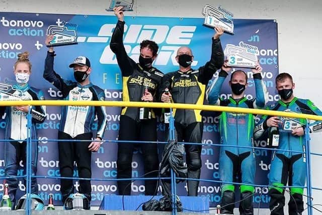 On the podium.