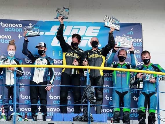On the podium.