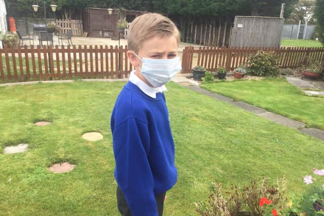 Kieron Meade ready to return to school wearing a mask.