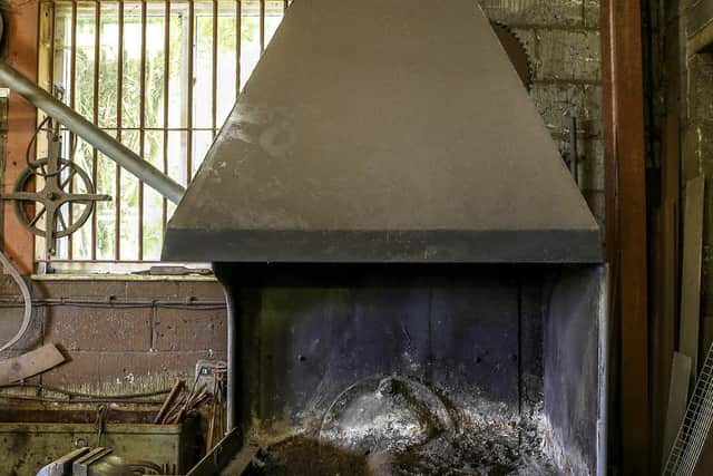 The smithy's now cold forge.