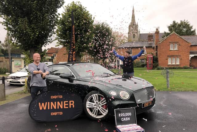 Heckington pub landlord Stephen McHugh celebrates his win with BOTB presenter Christian Williams. EMN-201019-181615001