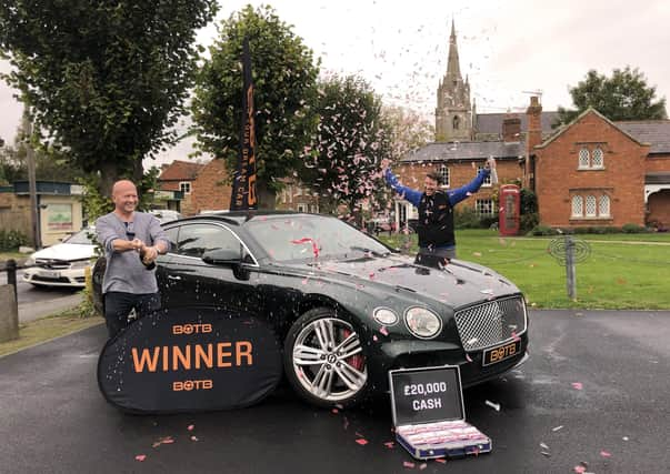 Heckington pub landlord Stephen McHugh celebrates his win with BOTB presenter Christian Williams. EMN-201019-181615001