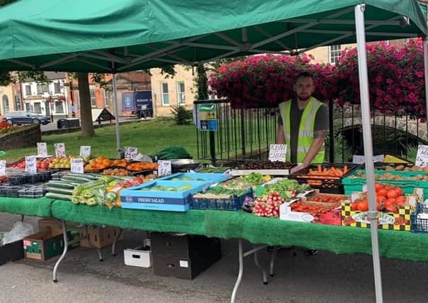Jaedon Williamson runs a fruit and veg stall at Sleaford market.