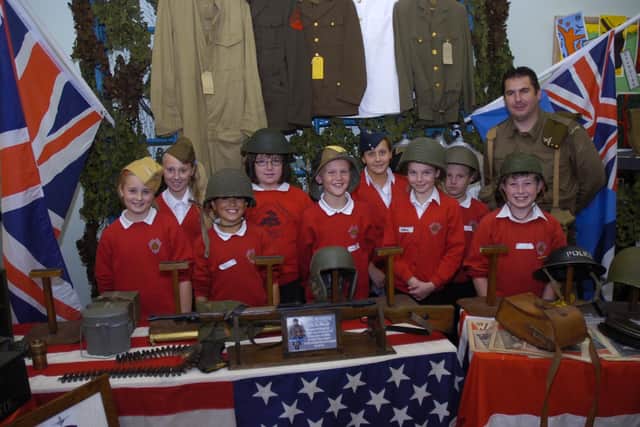 Pupils pictured with Paul Britchford of We'll Meet Again Collectables.