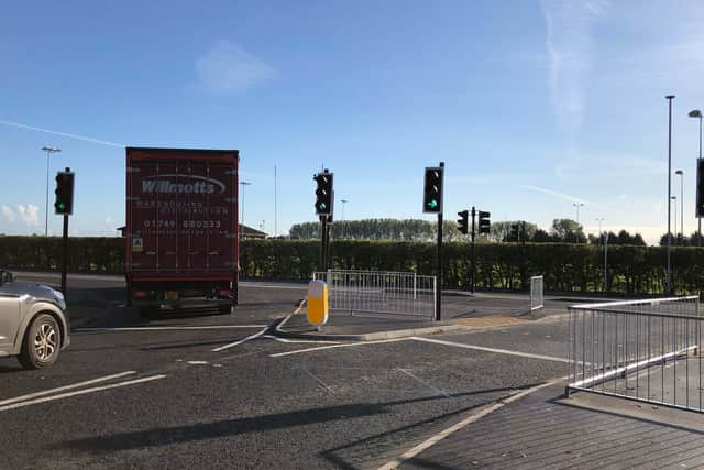 Traffic lights will make turning out of the A17 slip road onto the A153 safer. EMN-201015-170337001
