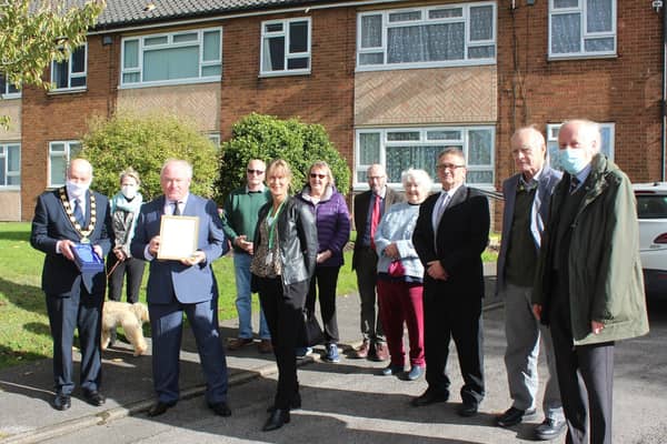 Contribution to the Environment: Neil Birkes is congratulated by councillors and local residents after receiving his award from Coun Steve England
