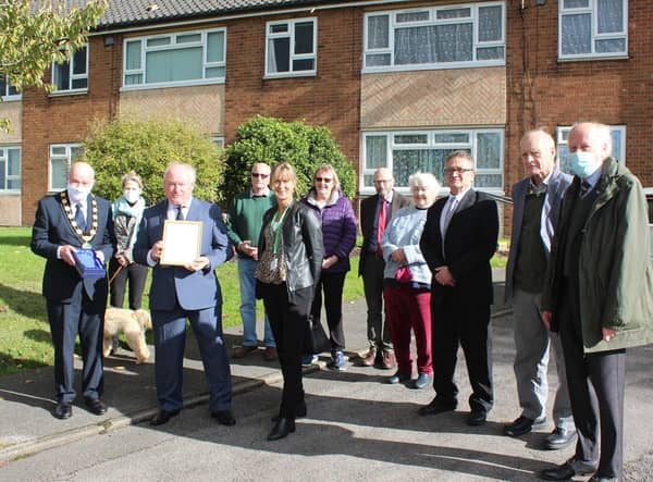 Contribution to the Environment: Neil Birkes is congratulated by councillors and local residents after receiving his award from Coun Steve England