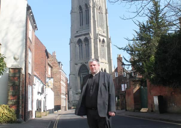 The Rector of Louth, Nick Brown, in front of St James’ Church.