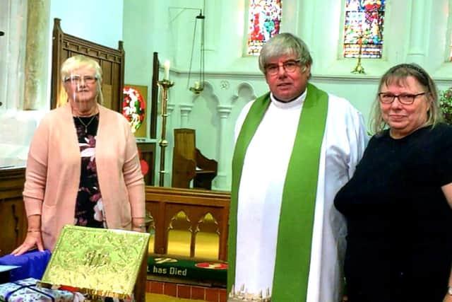Church Warden Val Waddington, left, with the Rev Canon Ian Robinson and Christine Robinson. Picture Peter Thompson EMN-201021-122446001