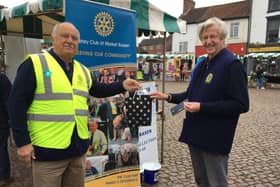 Outgoing president Jo Bowman, right, receiving a gift from former president Neil Taylor