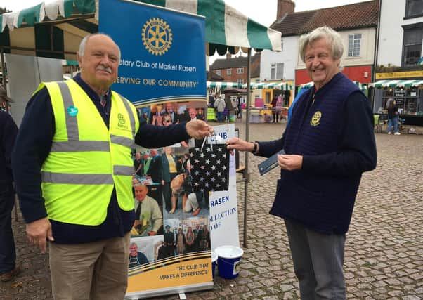 Outgoing president Jo Bowman, right, receiving a gift from former president Neil Taylor