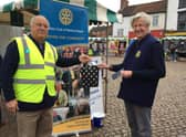 Outgoing president Jo Bowman, right, receiving a gift from former president Neil Taylor