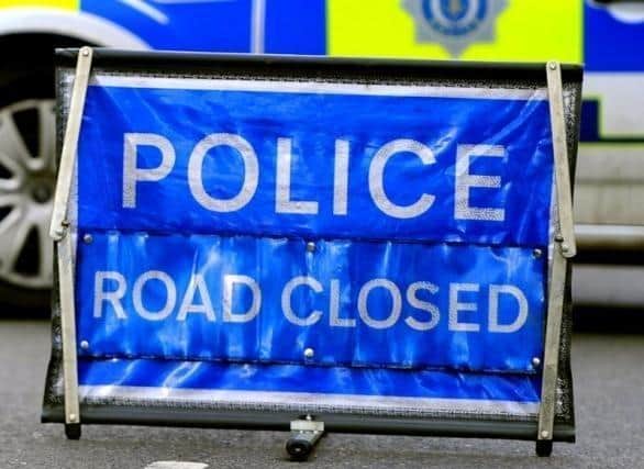 Stock image of a road closure following a serious collision.