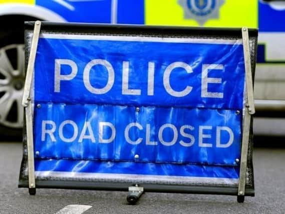 Stock image of a road closure following a serious collision.