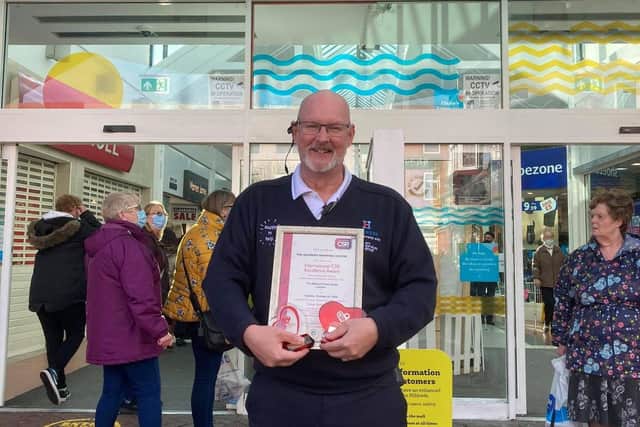 Steve Andrews, manager at the Hildreds Centre in Skegness, with two awards received for work with the community.