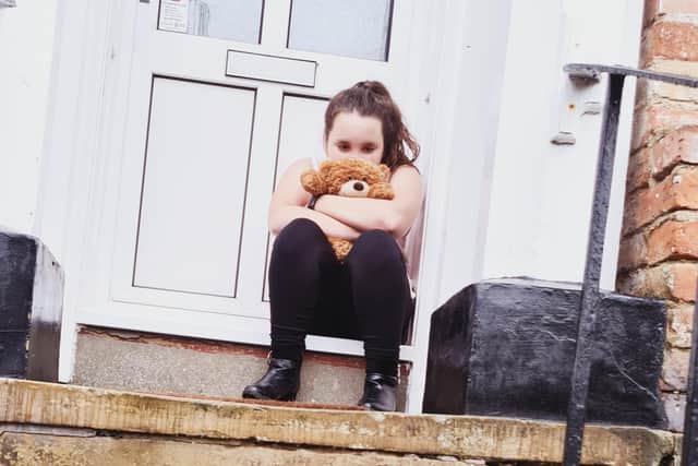 Maizie Williams, 10, on her great-grandfather's doorstep.