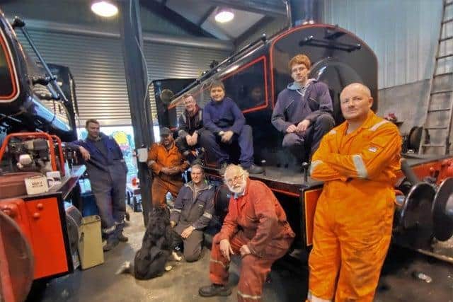 Lincolnshire Wolds Railway volunteers with ‘Maggie the Shed Dog’.