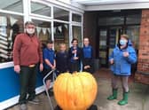 Simon Croson (left) donated his 300lb pumpkin to Caythorpe Primary School
