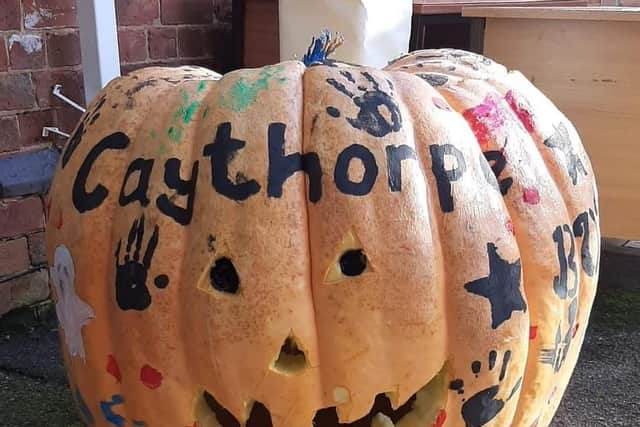 Simon Croson's giant 300lb pumpkin, decorated by Caythorpe Primary School pupils.