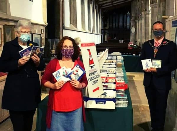 Mayor of Louth, Councillor Darren Hobson, (right) pictured at the Cards for Good Causes pop up shop.