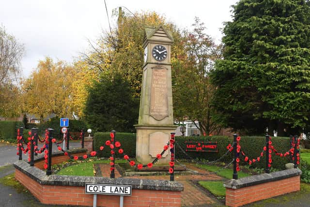 Members of Stickford WI have made poppies to decorate their memorial.