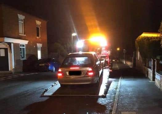 An uninsured car without MOT or tax seized by police on Victoria Street, Billinghay. EMN-200411-143049001