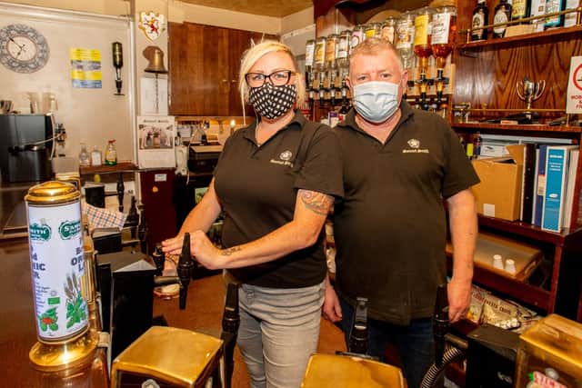 Les Preece, bar manager at the Red Lion, and barmaid Aissa Moody at work on the last night before lockdown