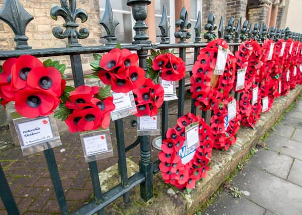A field of poppies: Just some of the wreaths displayed on the railings of the War Memorial Hospital in Horncastle.
