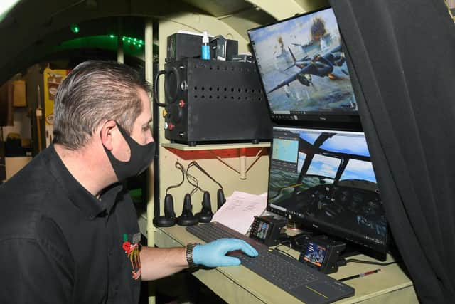 Paul Britchford behind the scenes of the Lancaster Bomber VR simulator.