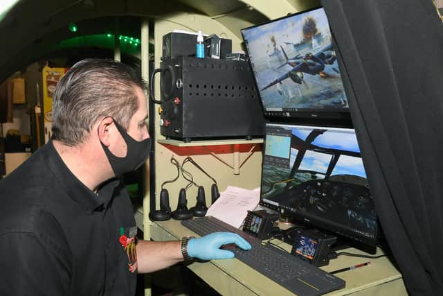 Paul Britchford behind the scenes of the Lancaster Bomber VR simulator.