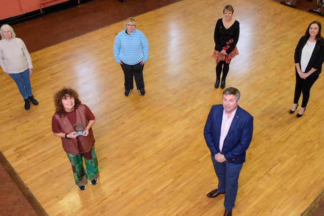 Martin and Timberland Emergency Support group representatives, from left, Brenda Crouch, Lindsay Fulton, Tracy Wilkinson, Clare Pearson and Janet Burrows, receiving their NK Community Champions Award by Coun Richard Wright, leader of North Kesteven District Council. Picture: Chris Vaughan Photography for NKDC EMN-200511-180206001