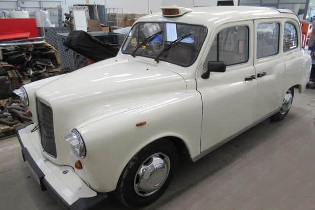 A 1997 London taxi that has been converted into a wedding car. EMN-200611-143101001