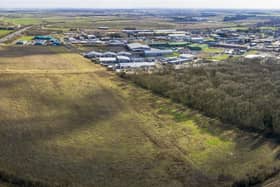 An aerial view of the site purchased for the Sleaford Moor Enterprise Park. You can see the adjoining units off Pride Parkway and neighbouring Sleaford Wood. EMN-200611-150539001