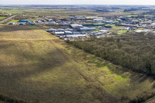 An aerial view of the site purchased for the Sleaford Moor Enterprise Park. You can see the adjoining units off Pride Parkway and neighbouring Sleaford Wood. EMN-200611-150539001