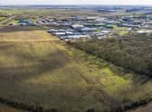 An aerial view of the site purchased for the Sleaford Moor Enterprise Park. You can see the adjoining units off Pride Parkway and neighbouring Sleaford Wood. EMN-200611-150539001