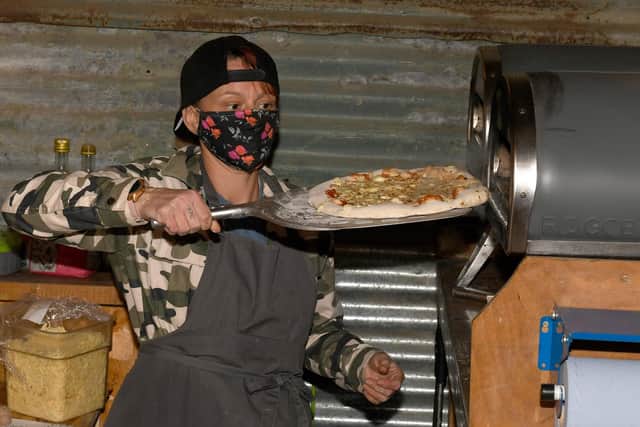 Sleaford during the second national lockdown. Watergate Yard doing takeaway service. Sara Paton making pizzas EMN-200711-171137001
