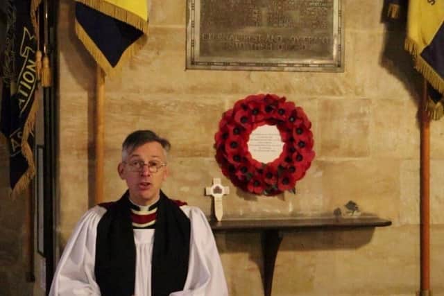 Rev Philip Johnson leading the pre-recorded Remembrance Sunday service. EMN-200811-103741001