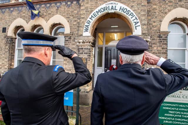 Police and the Fire Service salute the fallen
