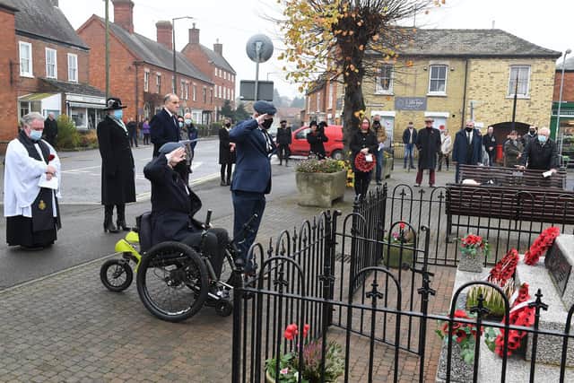 Remembrance Sunday at Heckington. L-R Eugene (Stun) Conlin laying a wreath on behalf of Royal Air Force Regiment, helped by Dave Brackley. EMN-200911-105452001
