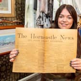 Thrifty’s owner Julie Clark with the historic copy of the Horncastle News.